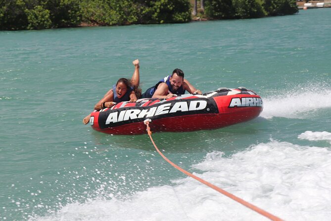 Combo Banana Boat Ride and Bumper Tube Ride in Hawaii - The banana boat tow: holding on when the wake gets personal