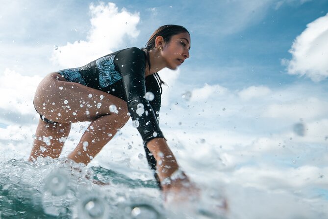 Group Surf Lesson in Honolulu - Gear included: reef shoes and rashguards remove the friction