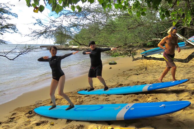 Group Surf Lessons for beginners on the North Shore of Oahu - In the Water on the North Shore: Paddling, Standing, and First Rides